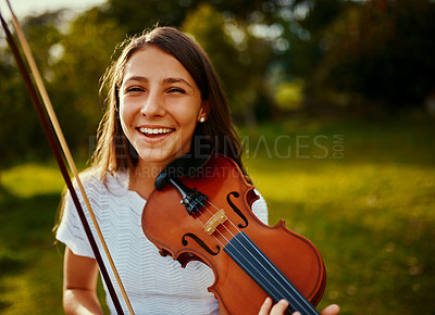 Buy stock photo Cropped shot of a young girl playing a violin outdoors