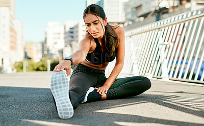 Buy stock photo Young woman, fitness or stretching with leg in city preparation for workout, exercise or outdoor training. Active, female person or runner in warm up or getting ready on bridge for muscle flexibility