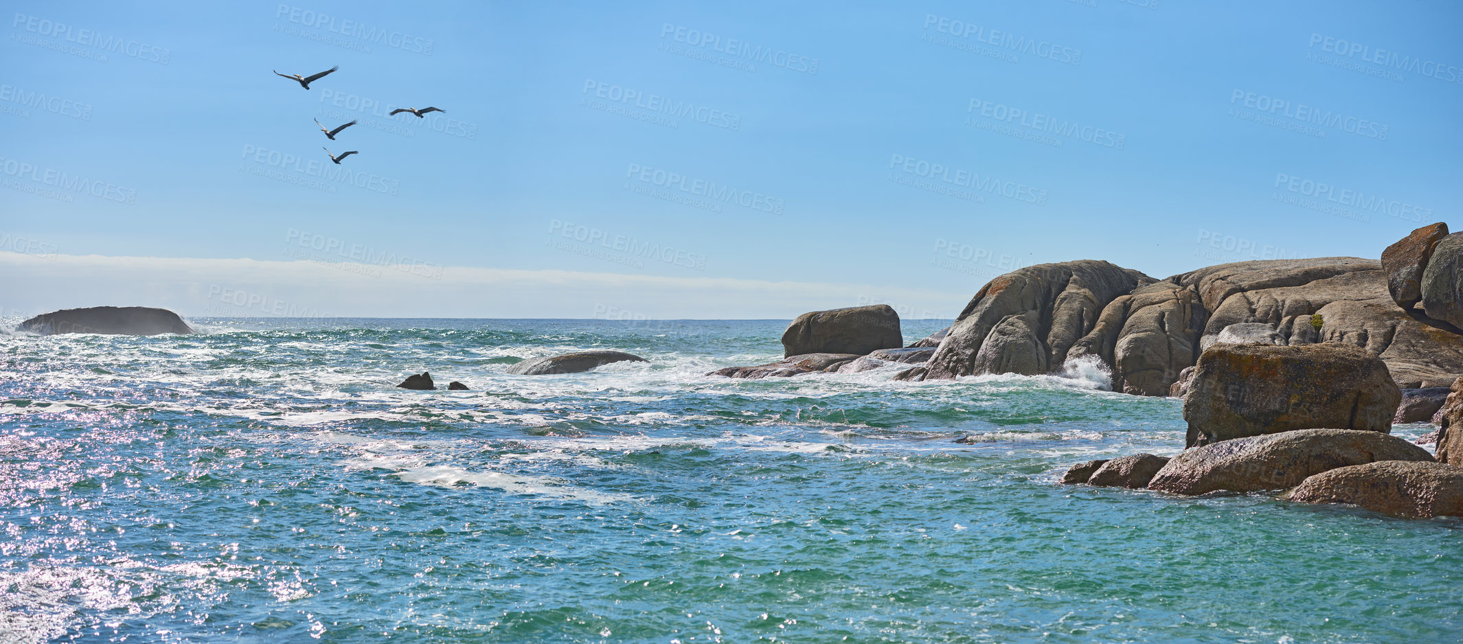 Buy stock photo Rocks, birds and blue sky at sea outdoor on holiday, migration and mockup space on banner. Ocean, water and travel with animals flying on vacation in environment, horizon and waves in Australia