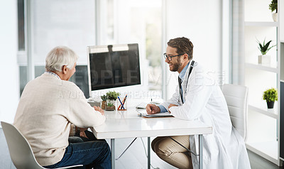 Buy stock photo Cropped shot of a confident young male doctor consulting a senior patient inside of the doctor's office