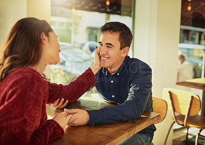 Buy stock photo Couple, touch and cheek with holding hands at cafe for valentines day, romantic date and commitment. Happy, people and support with healthy relationship, loyalty and bonding together at restaurant