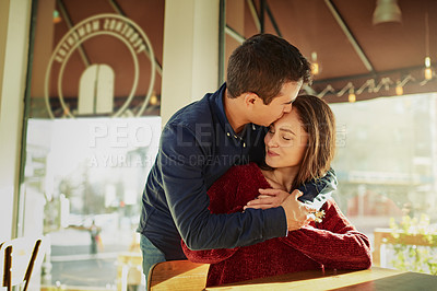 Buy stock photo Smile, couple and kiss on forehead on date at cafe for valentines day, romantic celebration and commitment. Happy, people and support of relationship trust, loyalty and bonding together at restaurant