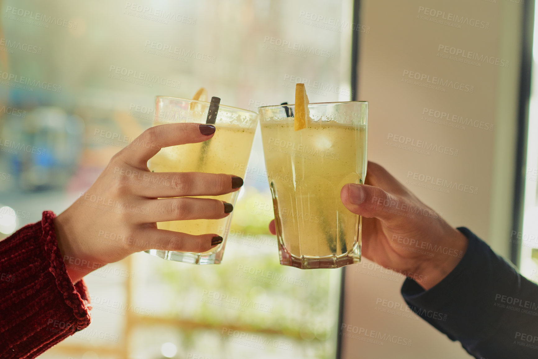 Buy stock photo Cropped shot of a couple toasting with their drinks at a coffee shop