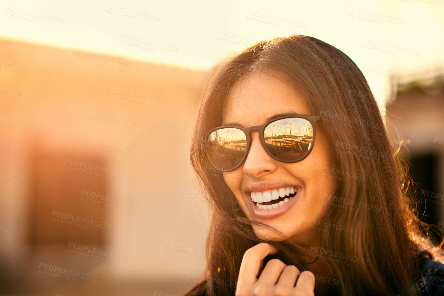 Buy stock photo Face, smile and sunglasses with woman outdoor in summer for holiday, travel and sunset. Laughing, shades and wellness with happy tourist person in urban neighborhood for break or trip abroad