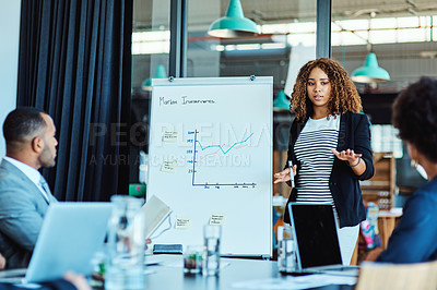 Buy stock photo Shot of a businesswoman giving a presentation to her colleagues in an office