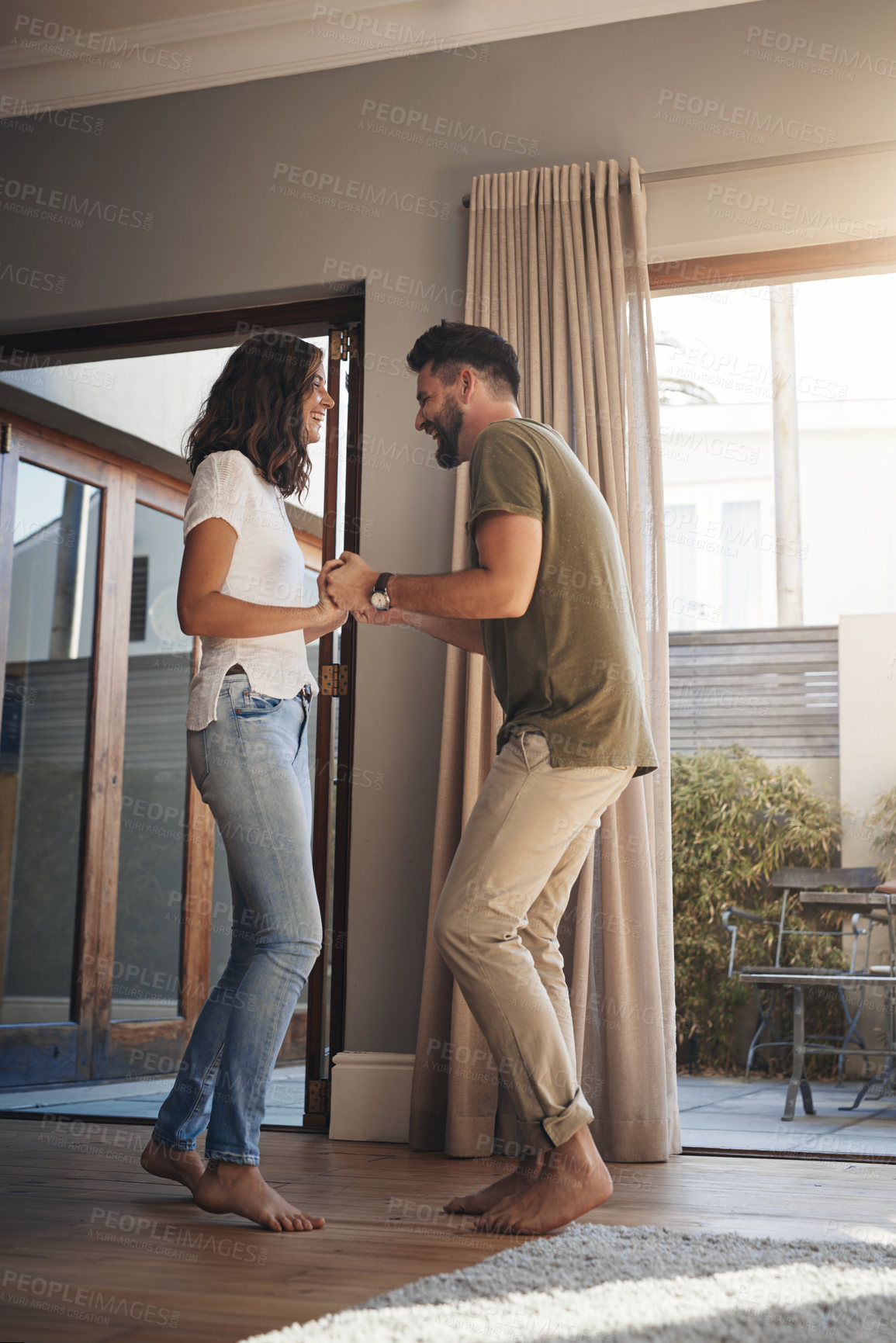 Buy stock photo Couple, smile and dance with holding hands at house for love, moving and bonding together of commitment. Happy, people and support with romance morning, celebrate marriage and energy for relationship