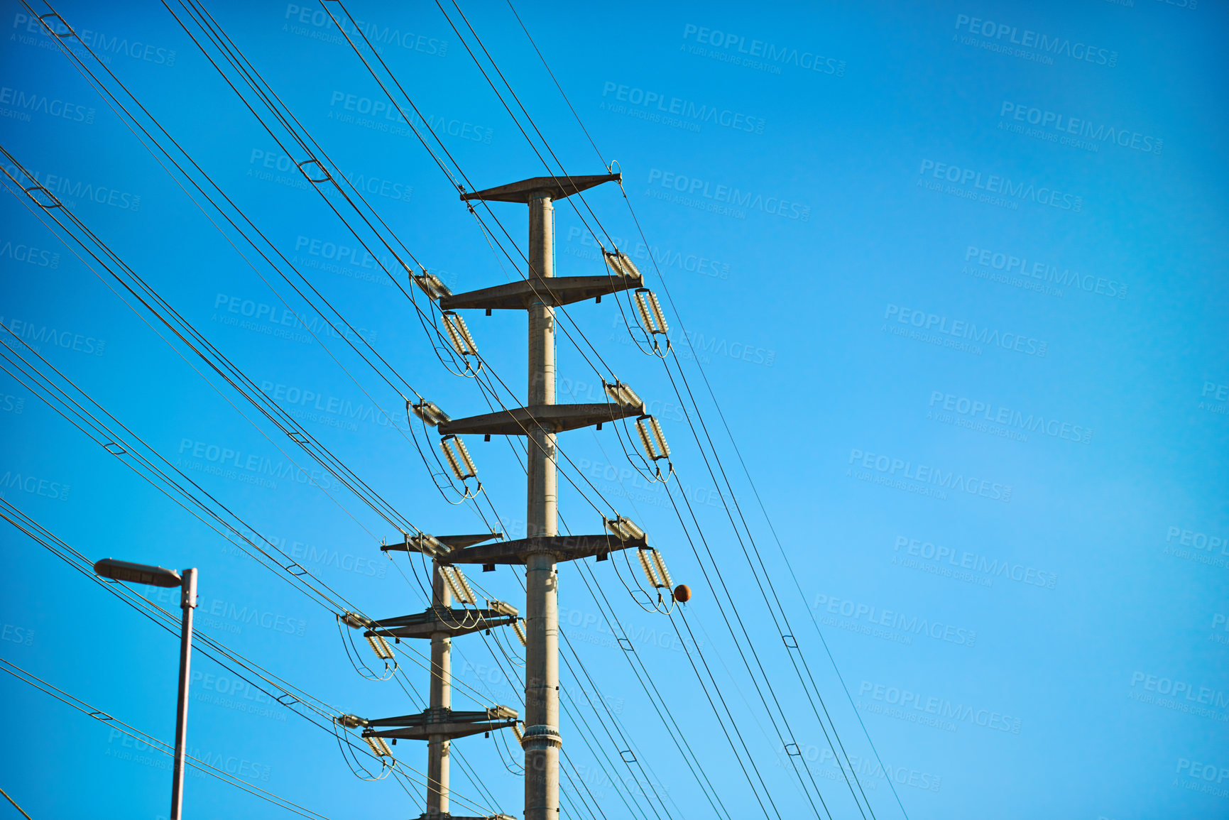 Buy stock photo Shot of a pylon against a blue sky