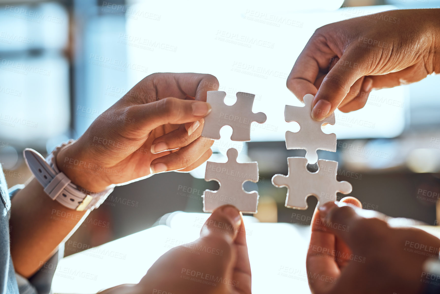 Buy stock photo Closeup shot of an unrecognizable group of people joining puzzle pieces together
