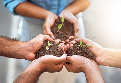 Buy stock photo Closeup shot of a group of people holding plants growing in soil