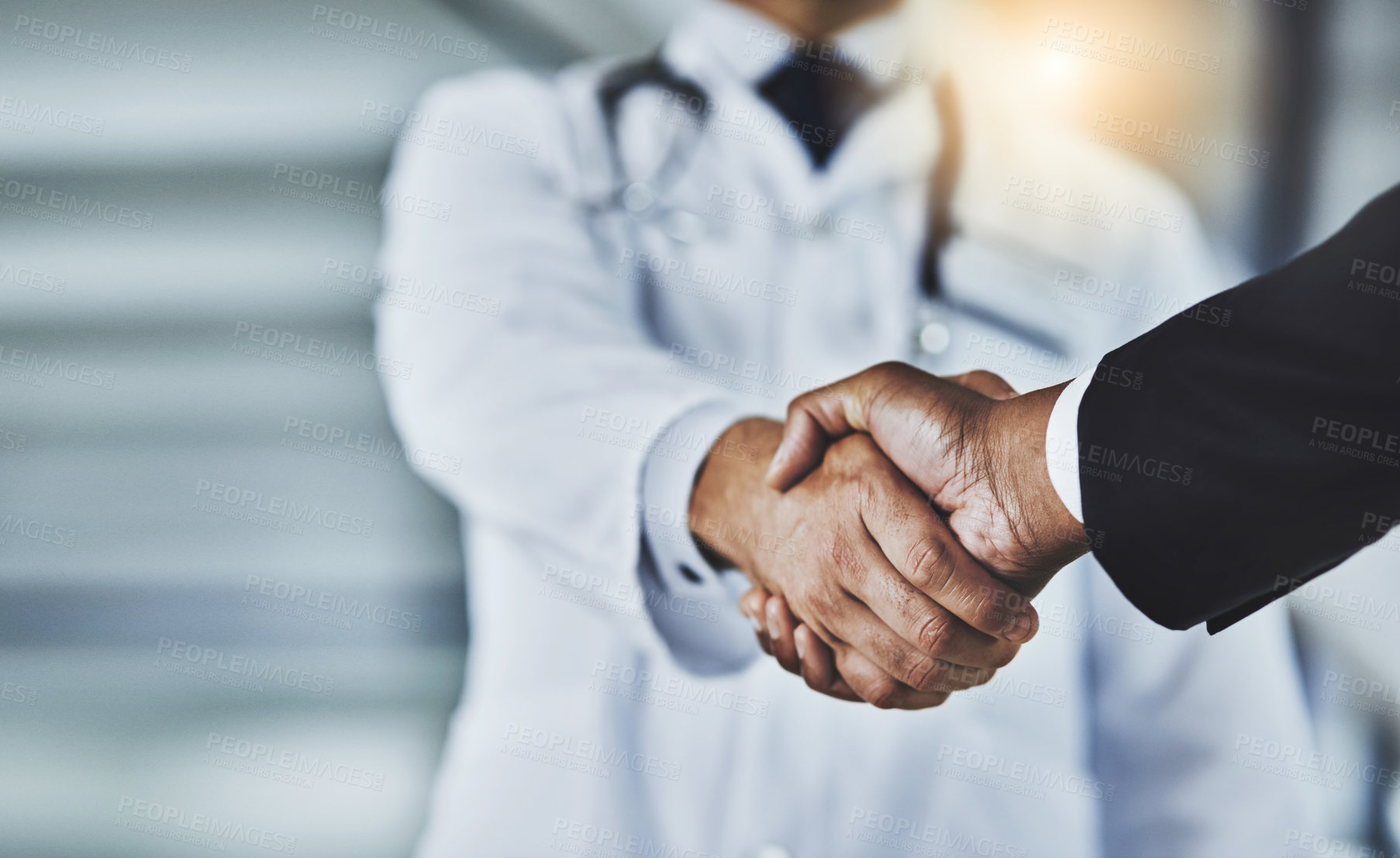 Buy stock photo Closeup, doctor and man with handshake, consultation and partnership for healthcare development, growth and agreement. Zoom, medical professional and patient with greeting, shaking hands and wellness