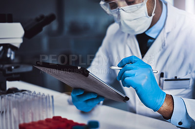 Buy stock photo Cropped shot of an unrecognizable male scientist working in a lab