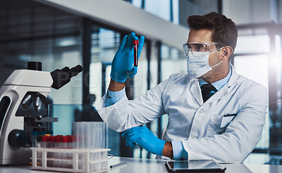 Buy stock photo Cropped shot of a young male  scientist working in a lab