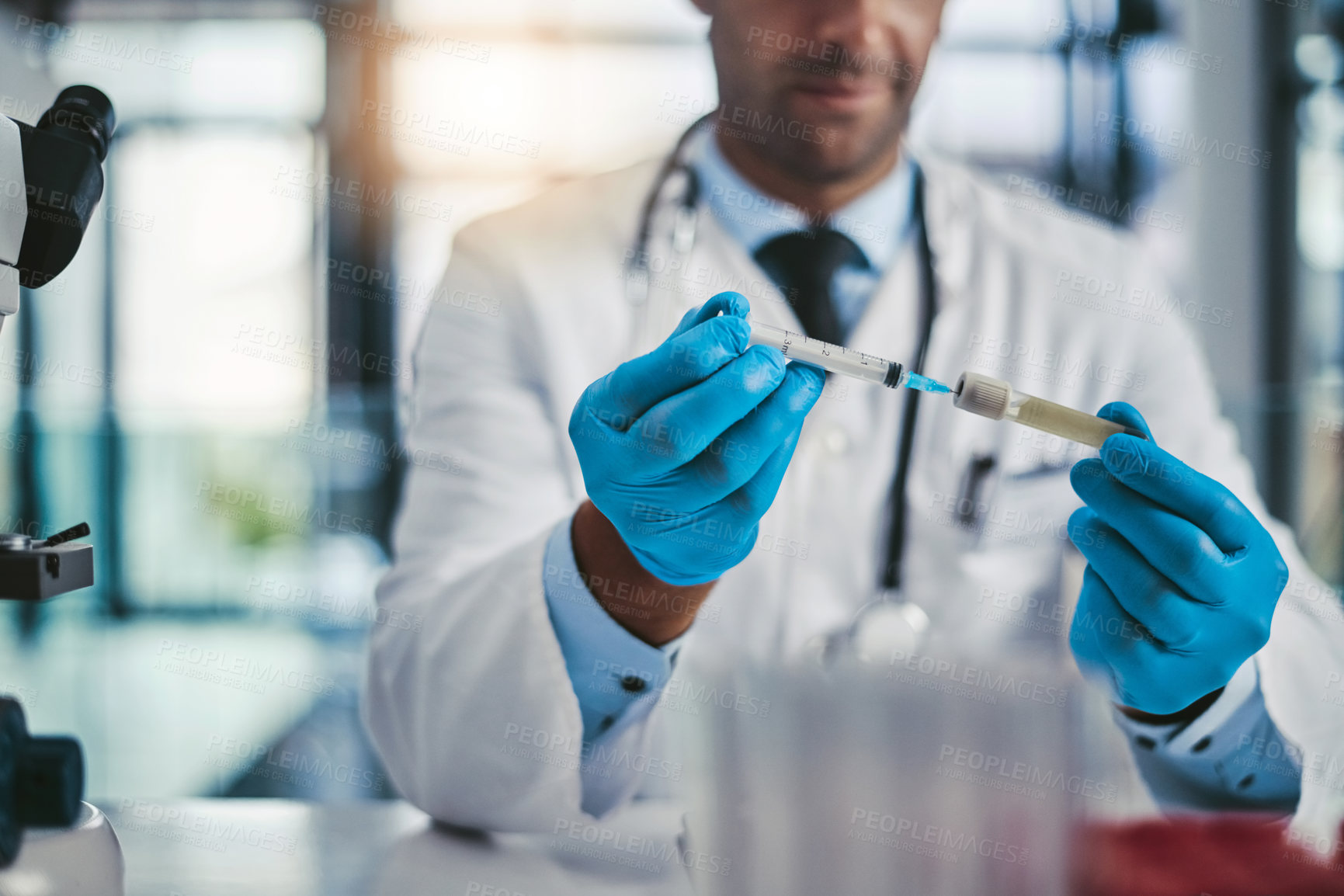 Buy stock photo Cropped shot of an unrecognizable male scientist working in a lab