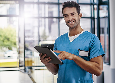 Buy stock photo Portrait of a young handsome male medical practitioner working in a hospital