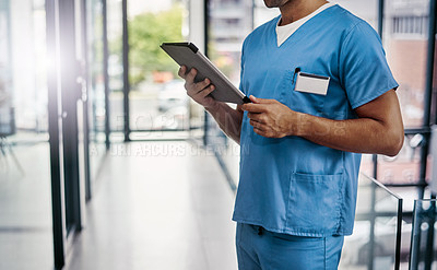 Buy stock photo Cropped shot of an unrecognizable male medical practitioner working in a hospital