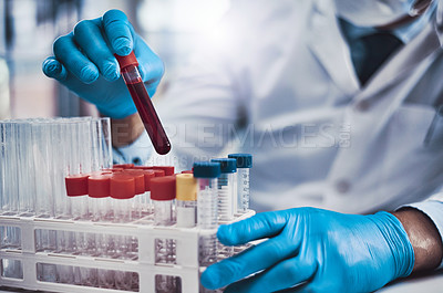 Buy stock photo Cropped shot of an unrecognizable scientist working in a lab