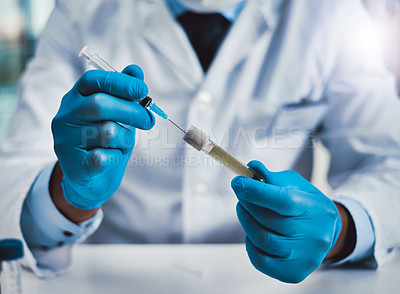 Buy stock photo Cropped shot of an unrecognizable male scientist working in a lab