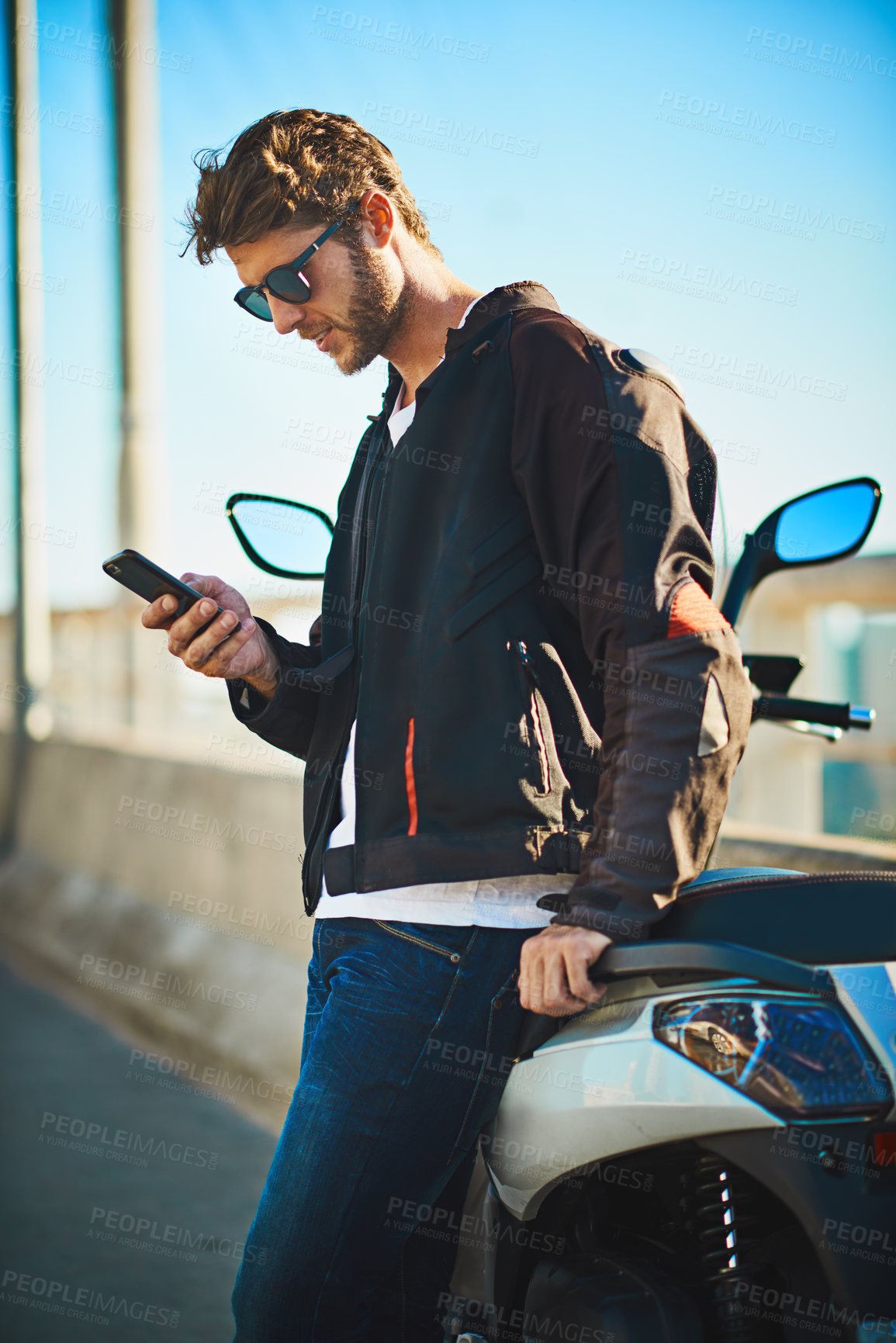 Buy stock photo Biker, travel and phone with man in city for motorcycle, location search and transportation. Journey, summer vacation and app with person and motorbike for vintage driver, adventure and explore