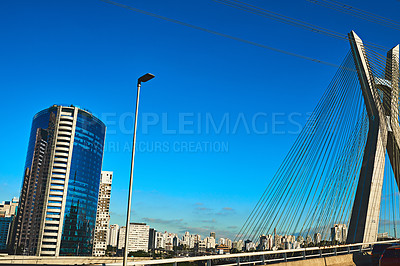 Buy stock photo City, outdoor and buildings with blue sky, urban town and structure with metropolitan. Empty, New York and development with streets, landscape and nature with summer, cables and architecture