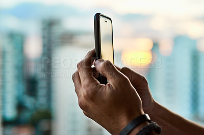 Buy stock photo City, person and hands with phone for photography, view and digital image in urban town. Blur, tourism closeup or travel picture of buildings at sunset for memory, social media post and personal blog