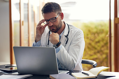 Buy stock photo Male person, physician and laptop with thinking, ideas and planning in office as medical doctor. Man, pediatrician and diagnosis, telehealth and technology for patient records, medicine or surgery