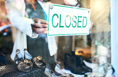 Buy stock photo Cropped shot of an unrecognizable woman holding up a closed sign