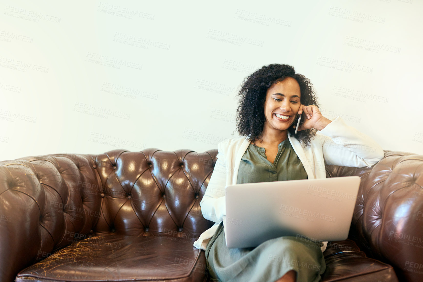 Buy stock photo Shot of a woman sitting on the sofa with her laptop