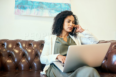 Buy stock photo Shot of a woman sitting on the sofa with her laptop