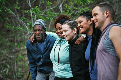 Buy stock photo Cropped shot of a sporty young group of friends working out in the forest