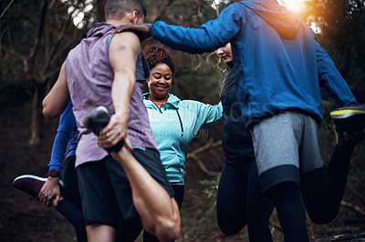 Buy stock photo Cropped shot of a sporty young group of friends working out in the forest