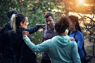 Buy stock photo Cropped shot of a sporty young group of friends working out in the forest