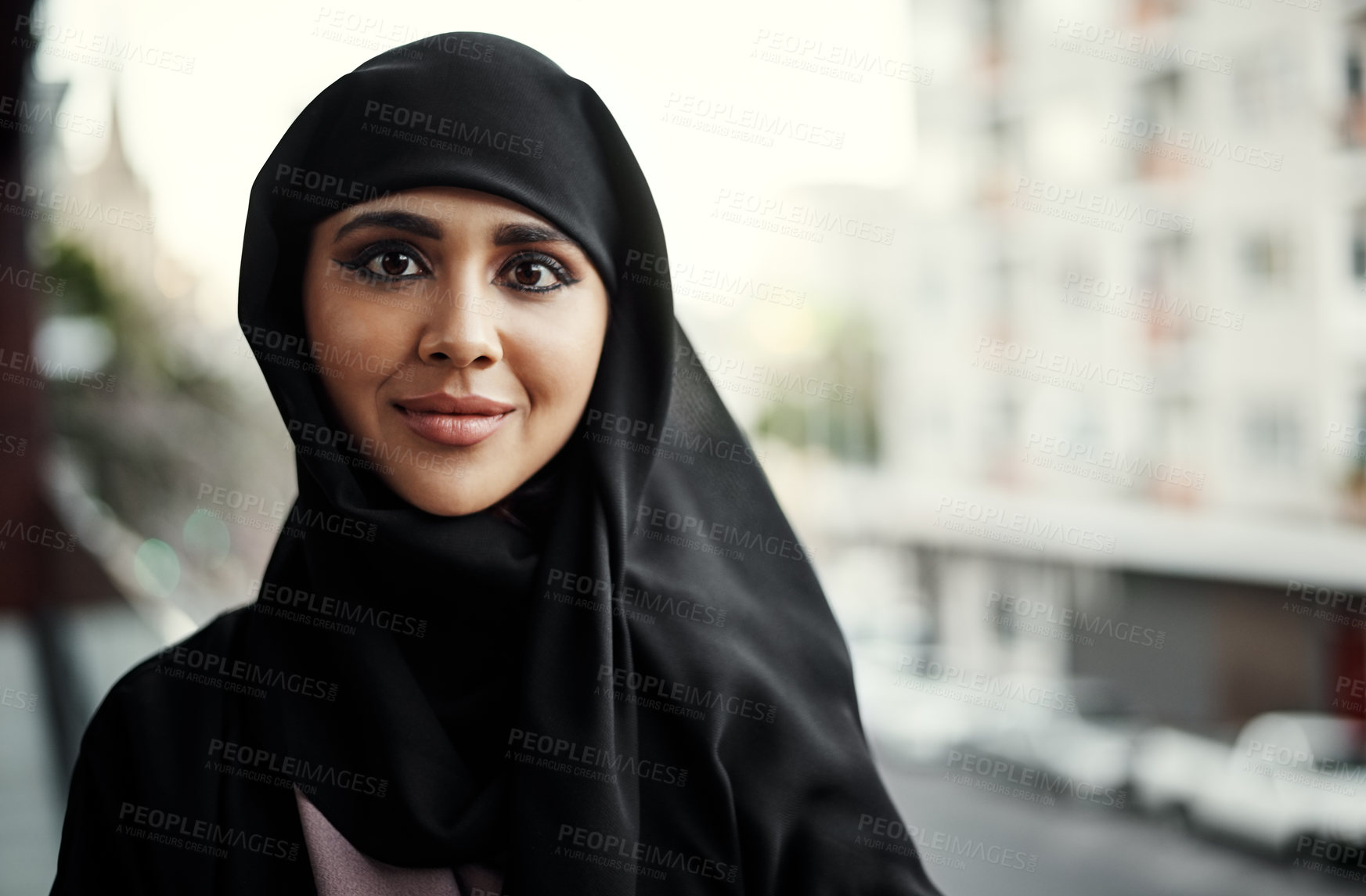 Buy stock photo Cropped portrait of an attractive young businesswoman dressed in Islamic traditional clothing standing on her office balcony