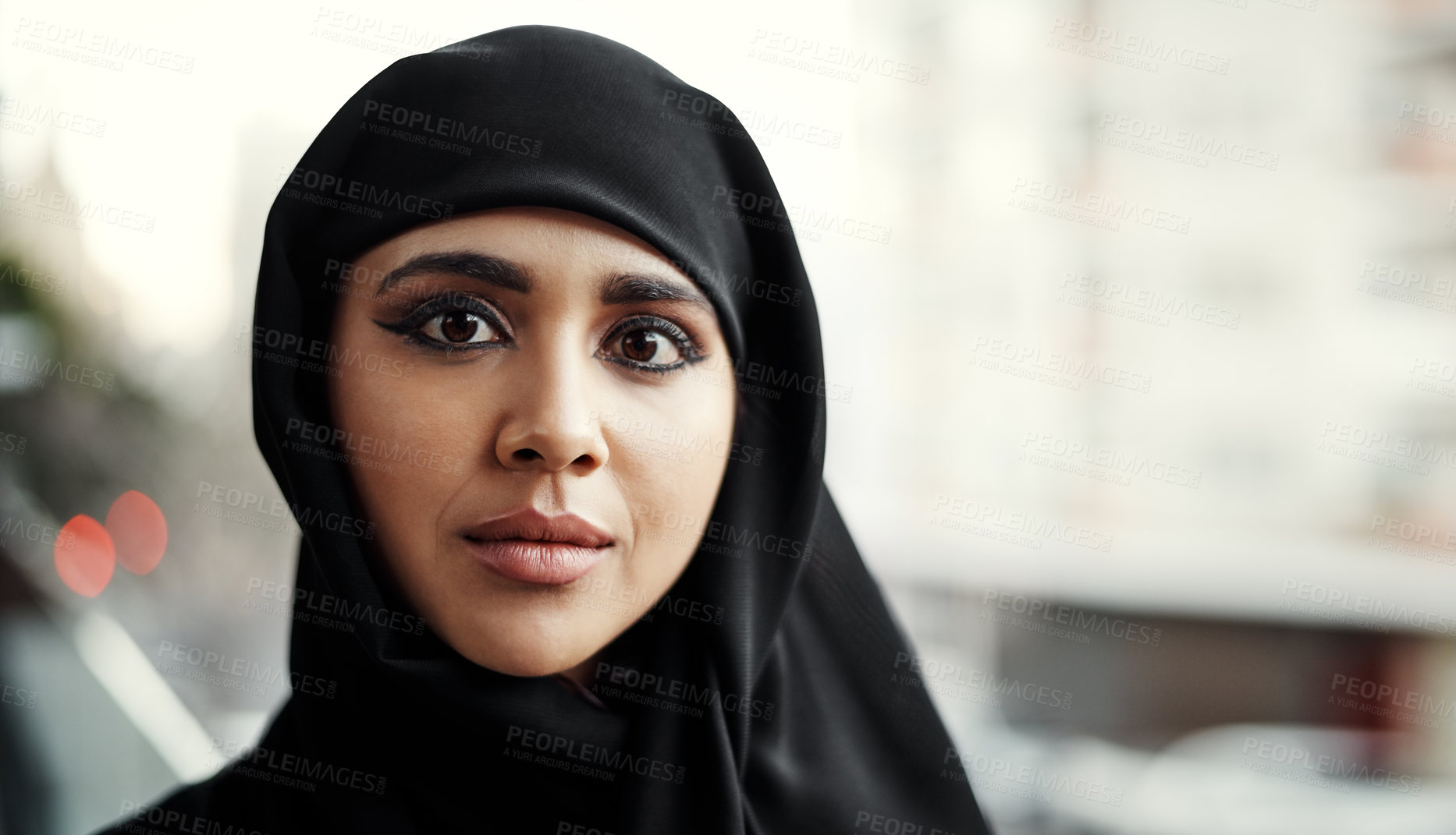 Buy stock photo Cropped portrait of an attractive young businesswoman dressed in Islamic traditional clothing standing on her office balcony