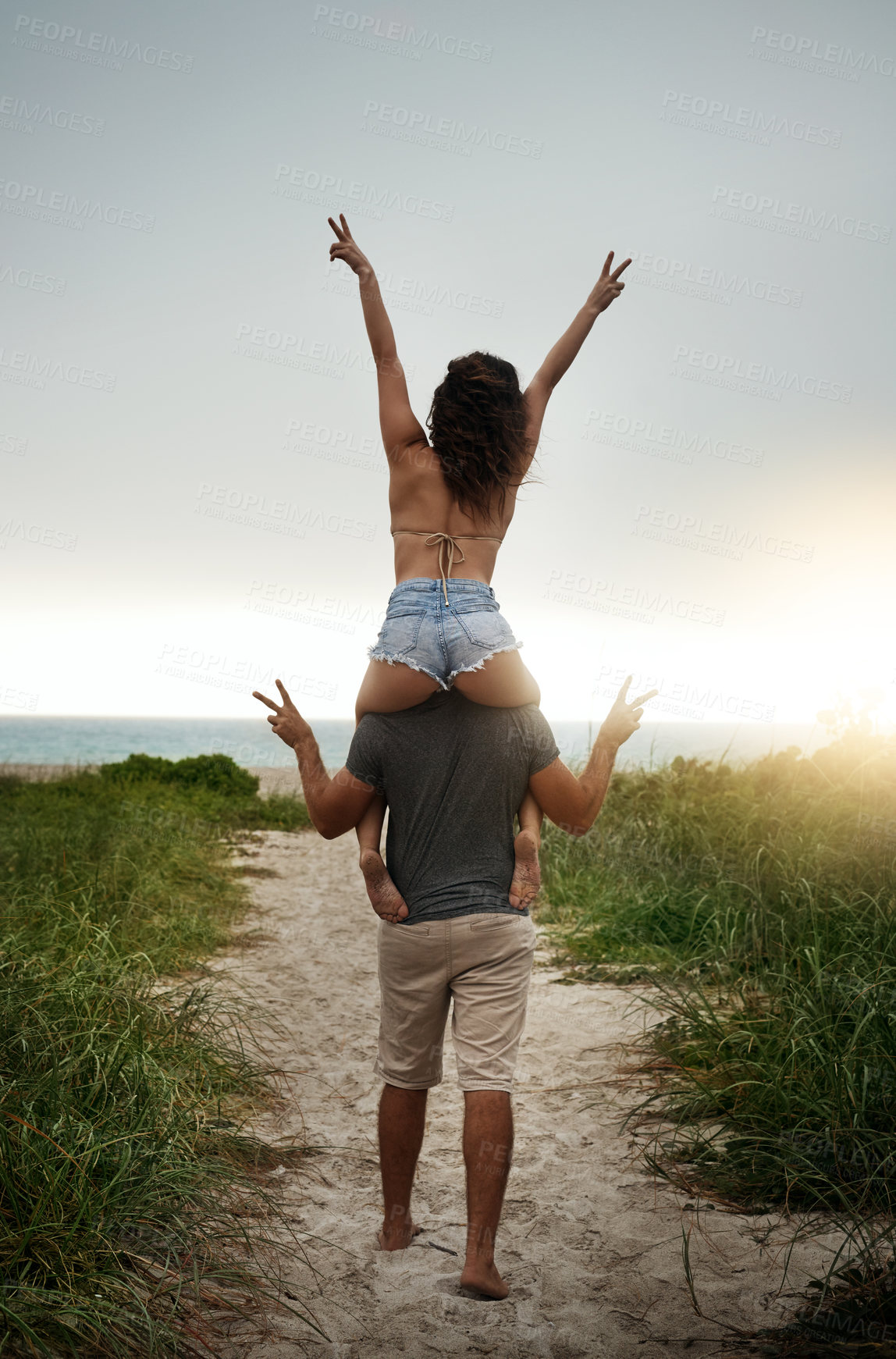 Buy stock photo Piggyback, peace sign and back of couple, outdoor and holiday for honeymoon, vacation or bonding. Beach, anniversary and commitment for relationship, travel and people in paradise, tropical or Cancun