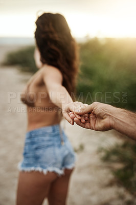 Buy stock photo POV, couple and holding hands at beach for love, care and holiday date at sunset. Leading, man and woman together at ocean for romantic relationship, tourism and follow on vacation for travel closeup