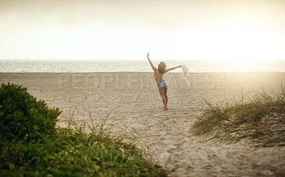 Buy stock photo Beach, woman and excited with open arms on break for summer holiday, adventure and relax. Back view, female person and energy or freedom at ocean with vacation for chilling, rest and fresh air