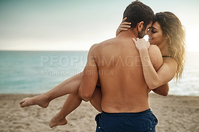 Buy stock photo Carry, romantic or couple at beach with love and support on vacation, valentines day or holiday. Lifting, care or man with embrace or woman for bonding together by ocean for honeymoon trip on island