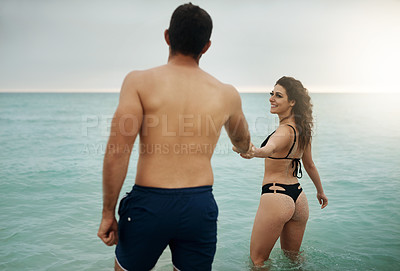 Buy stock photo Love, holding hands or happy couple at sea on vacation, adventure or holiday on valentines day. Wellness, walking or people with smile for bonding together in ocean water for romantic trip on island