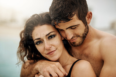 Buy stock photo Cropped shot of an affectionate  couple spending the day at the beach