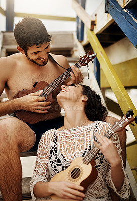 Buy stock photo Happy couple, travel and love at ocean with ukulele, music and fun with collaboration. Man, woman and instruments on beach house stairs for bonding, summer vacation and peace on holiday in Maldives