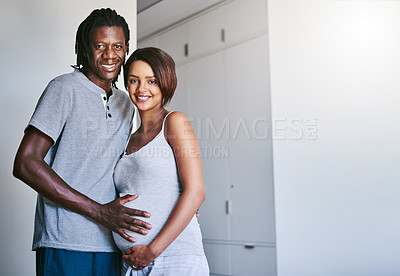 Buy stock photo Happy couple, portrait and pregnancy with tummy for maternity, expectation or start a family at home. Young man and pregnant woman with baby belly, hug or love for support or care together at house