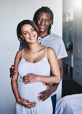 Buy stock photo Cropped shot of a young expecting couple at home