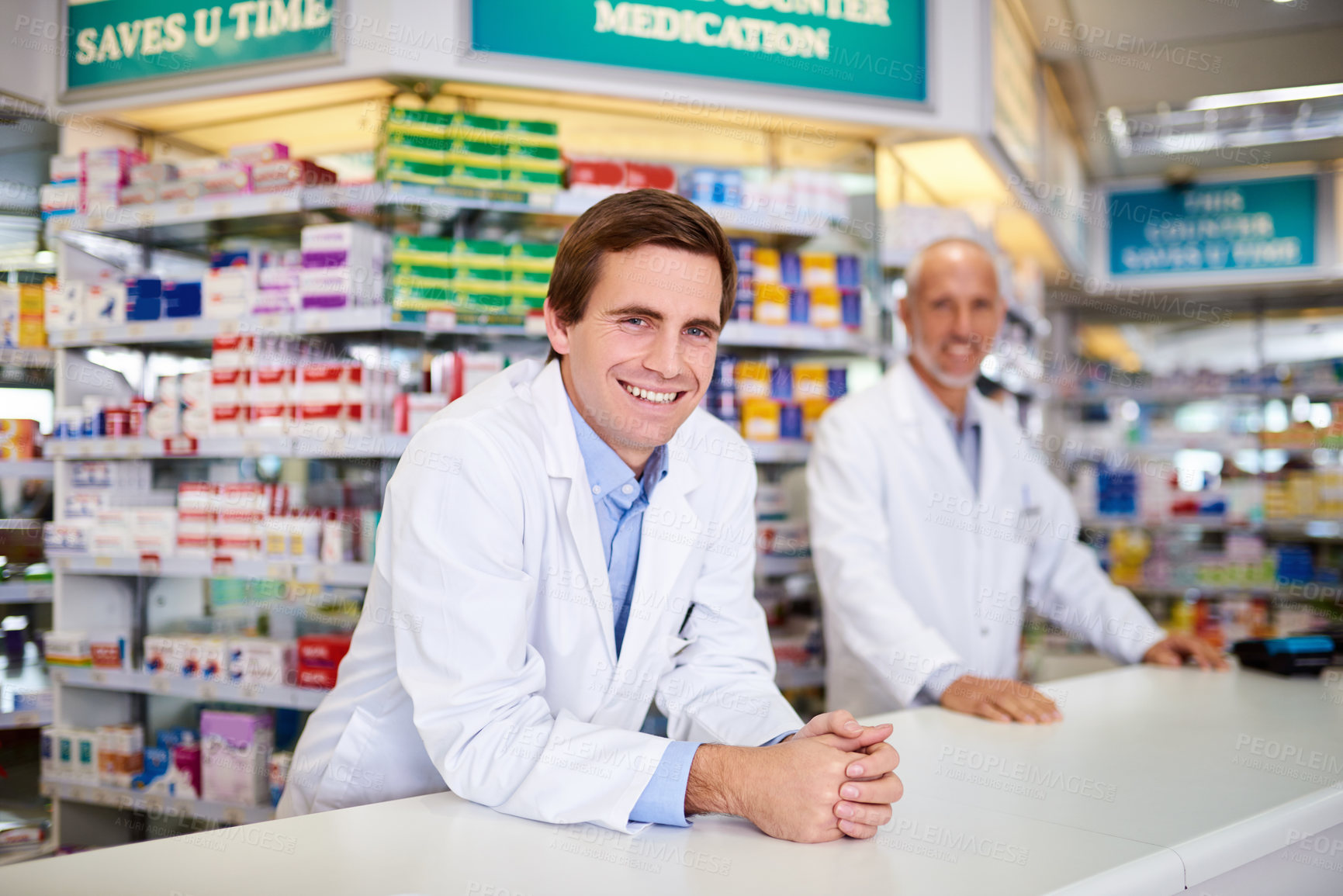 Buy stock photo Portrait of two male pharmacists working in a chemist