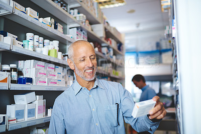 Buy stock photo Mature man, shelf and customer in pharmacy for medicine, shopping and medical product with smile. Male person, search and reading label in chemist for health supplements, choice and healthcare pills