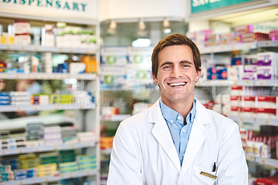 Buy stock photo Cropped portrait of a handsome young male pharmacist standing in the pharmacy