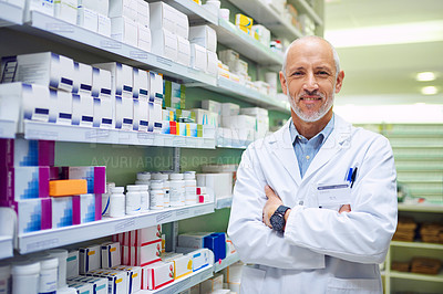 Buy stock photo Mature man, portrait and arms crossed at pharmacy, manager and confident chemist. Male person, pharmacist and proud of medication treatment at apothecary, expert service and store aisle in England