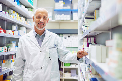 Buy stock photo Mature man, pharmacy portrait and inventory check at store, manager and confident chemist. Shop, dispensary and proud of medication treatment at apothecary, expert service and stock shelf in England