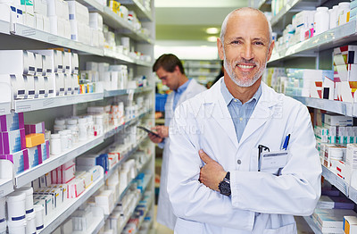 Buy stock photo Portrait of a confident mature pharmacist working in a pharmacy