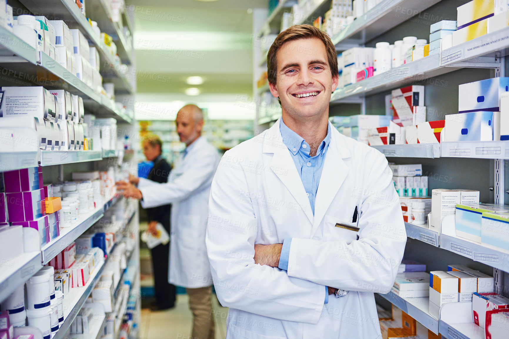 Buy stock photo Portrait of a confident young pharmacist working in a pharmacy