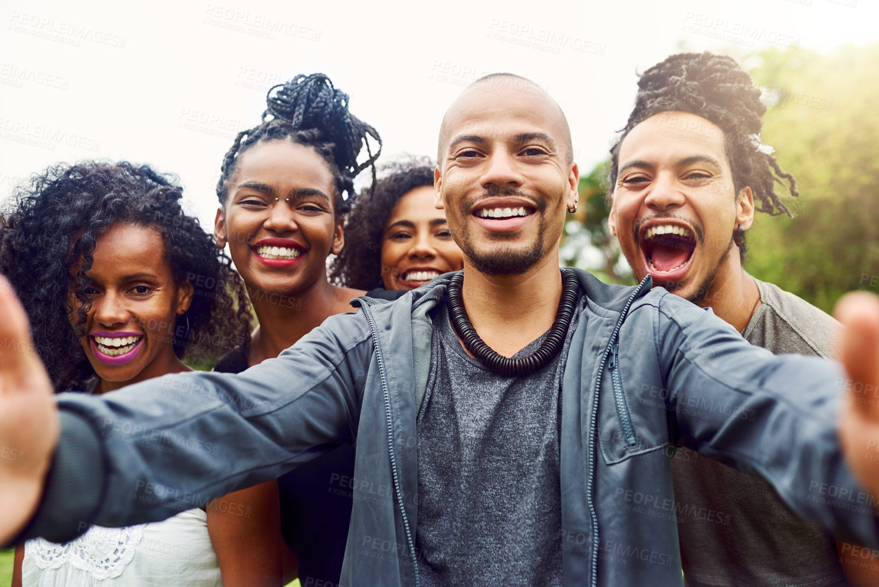 Buy stock photo Cropped shot of a group of friends posing together for a selfie